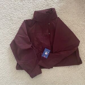 Champions waterproof coat brand new with tag.